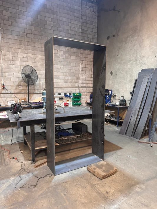 Custom fabricated steel portal frame in the workshop