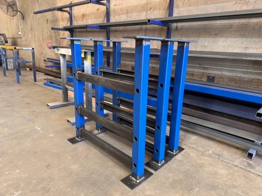 Batch of blue fabricated steel stands ready for dispatch